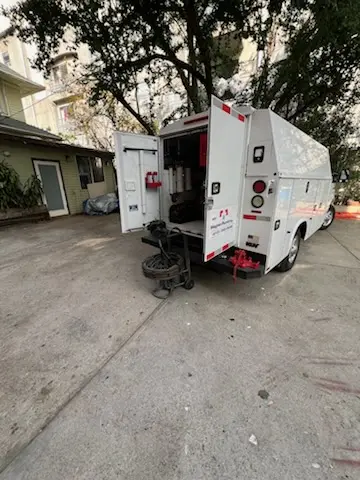 Magnet Plumbing service vehicle on-site for Water Heater Repair in Astrodome